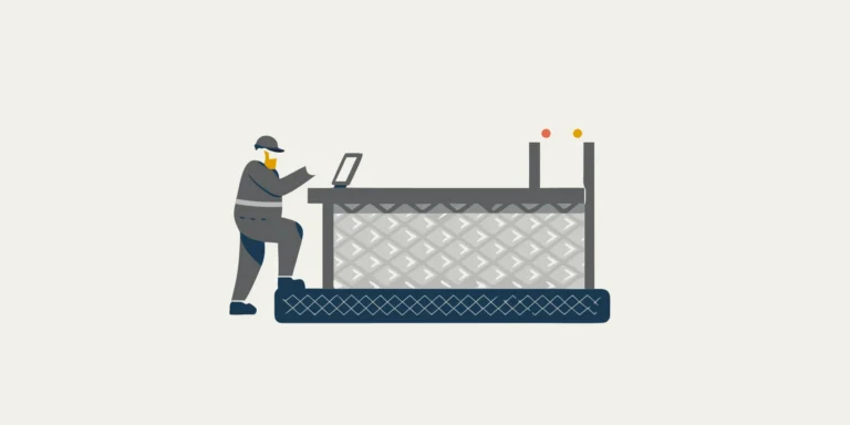 A worker uses an industrial floor scale from a reliable scale company in a warehouse.