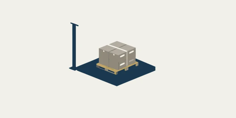 Industrial floor scale weighing a pallet of boxes.