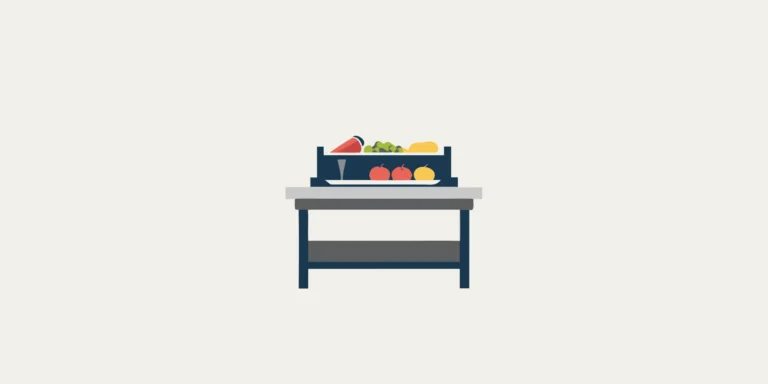 Digital portion control scale on a commercial kitchen counter with fresh ingredients